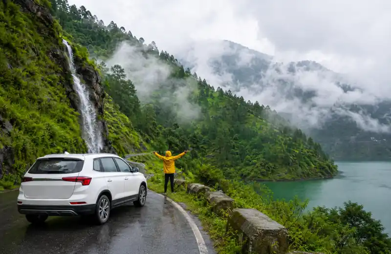Cloudy green mountain road during monsoon in Kumaon